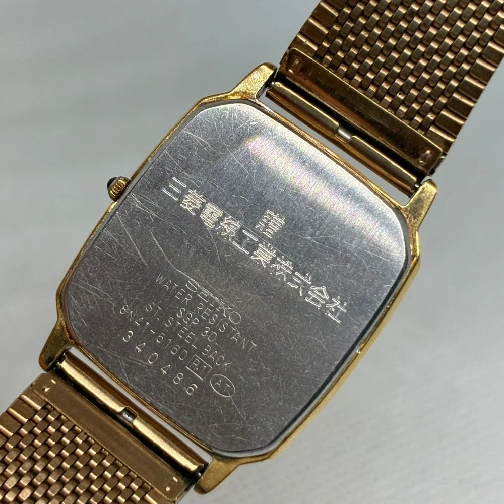 Seiko Dolce 8N41-5120 Men Watch Gold Tone Linen Dial Tank Square Mesh Band